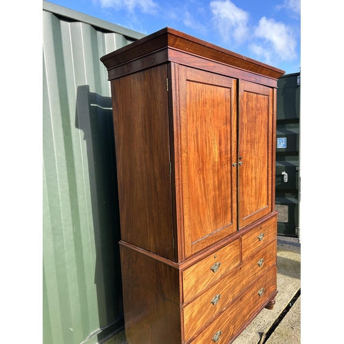 307 - A Victorian mahogany linen press with five slides to the top over five drawer base 136x58x210