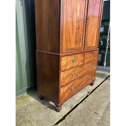 307 - A Victorian mahogany linen press with five slides to the top over five drawer base 136x58x210