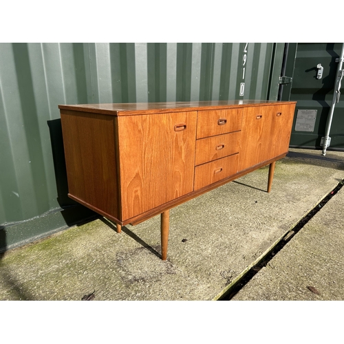 313 - A mid century teak sideboard  183x44x75