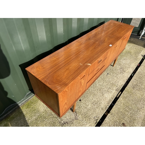 313 - A mid century teak sideboard  183x44x75