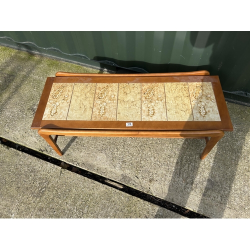 316 - A teak tile top coffee table