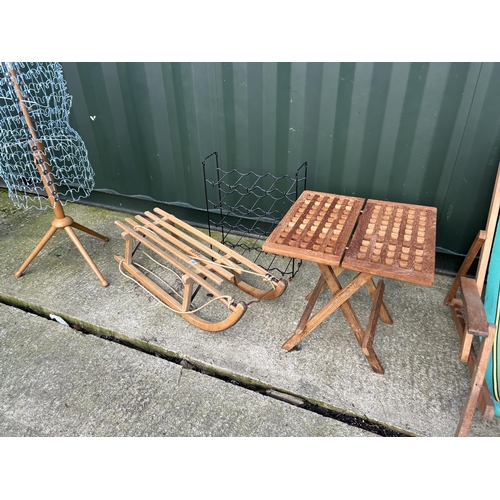 322 - Vintage sledge, two folding deck chairs, wine rack, mannequin and folding table