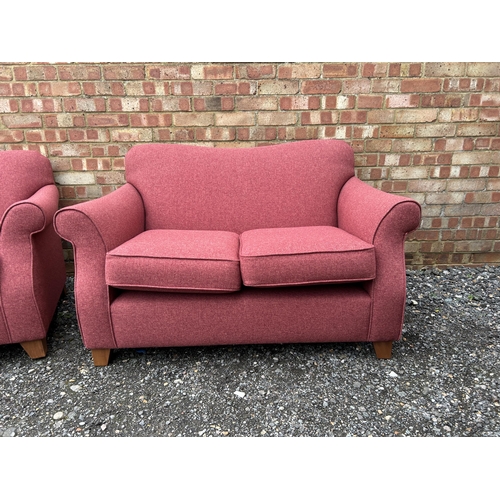 362 - A pair of modern red upholstered two seater sofas from NEXT