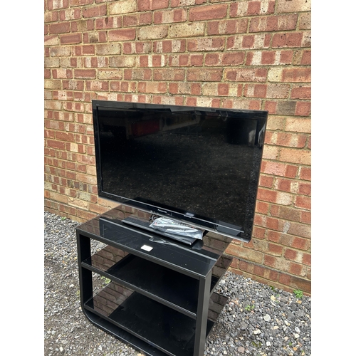 366 - Panasonic tv with black glass stand