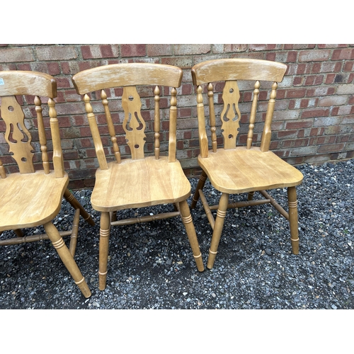 374 - A set of four pine chairs