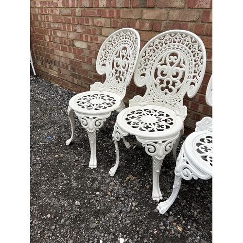 377 - A set of four white painted aluminium garden chairs