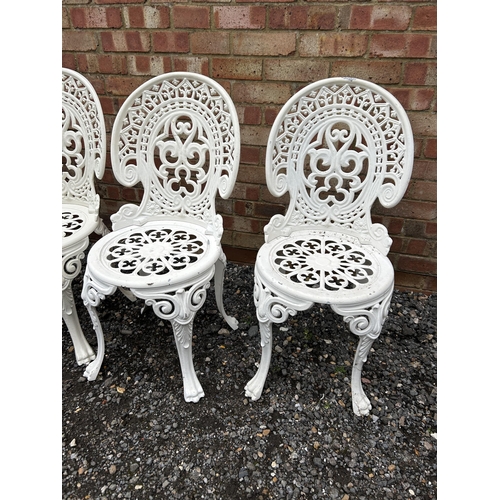 377 - A set of four white painted aluminium garden chairs