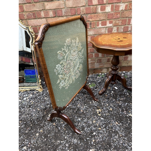 378 - A walnut folding fire screen , inlaid occasional table and a nest of three