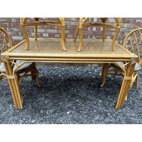 384 - A  vintage style bamboo dining table together with four chairs  136x75