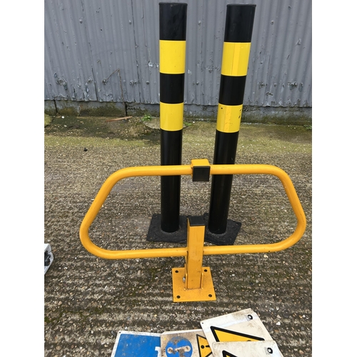 411 - Three parking bollards and warning signs