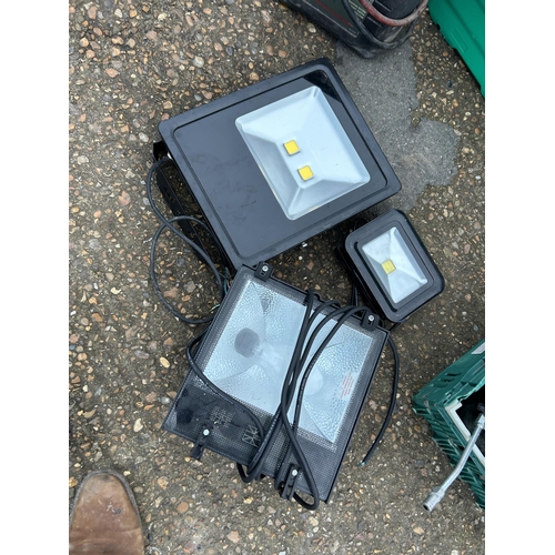 422 - Three flood lights, jump start pack and three crates tools