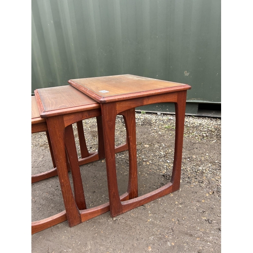 5 - A g plan or similar teak nest of three tables