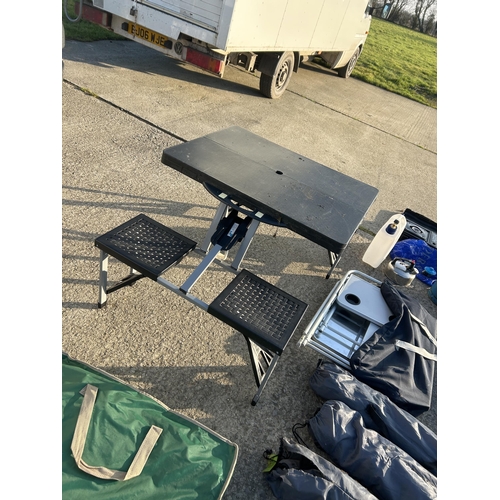 550a - A very large quantity of camping equipment, including picnic bench, folding chairs, stoves, bbq gas,... 