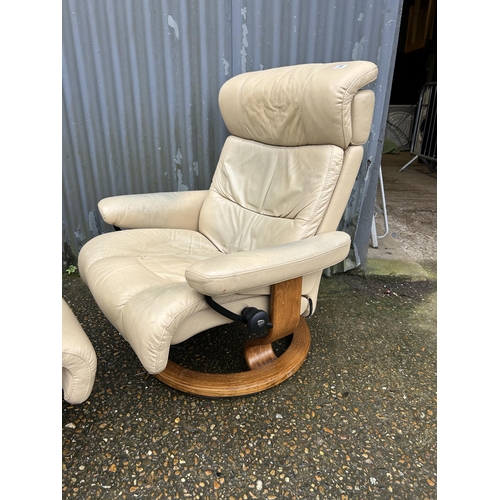 88 - An ekornes stressless cream leather recliner chair and stool