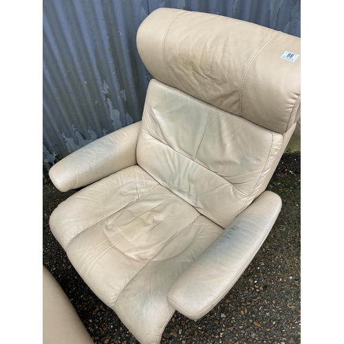 88 - An ekornes stressless cream leather recliner chair and stool