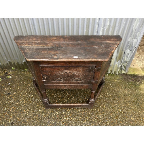 89 - An antique oak credence cupboard 134x56x90