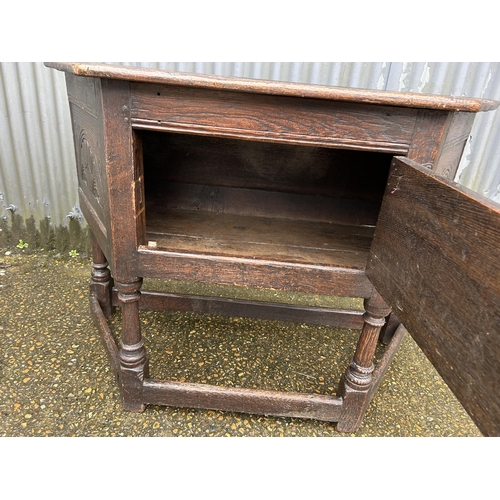 89 - An antique oak credence cupboard 134x56x90