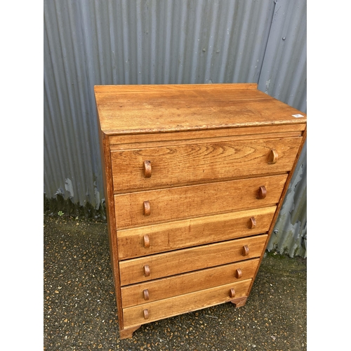 97 - A 20th century oak tallboy chest of six drawers 77x40x125