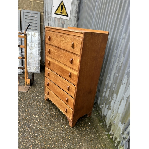 97 - A 20th century oak tallboy chest of six drawers 77x40x125