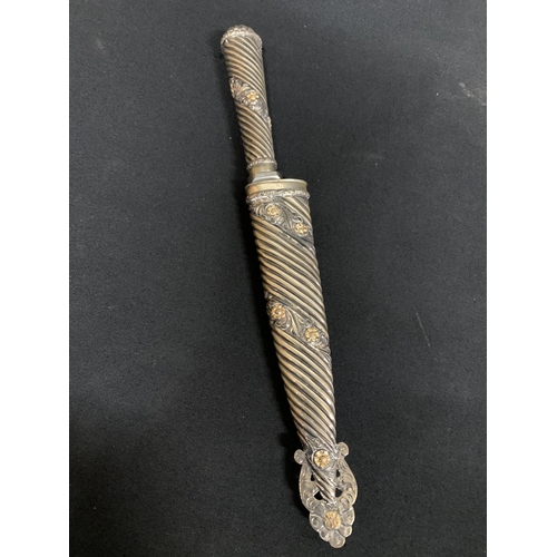 626 - Ornate metal cased dagger marked Rurch, Argentina