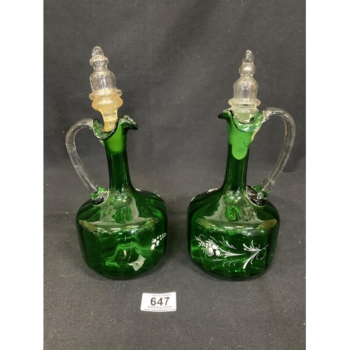 647 - Pair of green glass decanters a/f, (discolouration to 1 stopper, crack to top & wear to flowers on 1... 