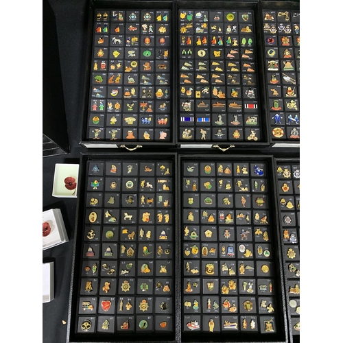 788 - A 10 drawer cabinet and 2 folders containing a collection of over 700 pin badges