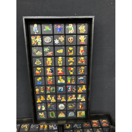 788 - A 10 drawer cabinet and 2 folders containing a collection of over 700 pin badges