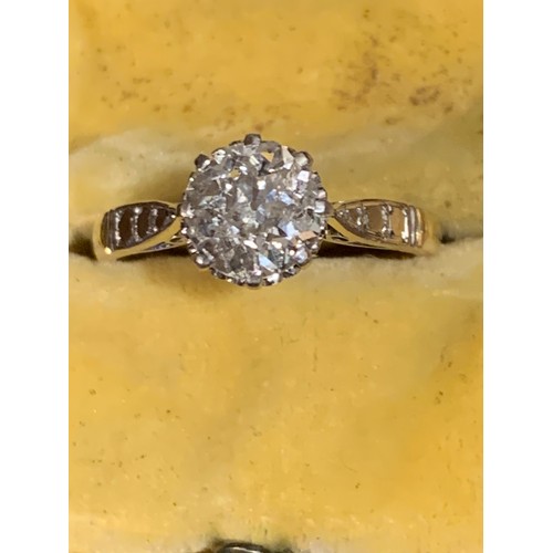 931 - A gold solitaire diamond ring, having a single old brilliant cut diamond in a claw setting with chen... 