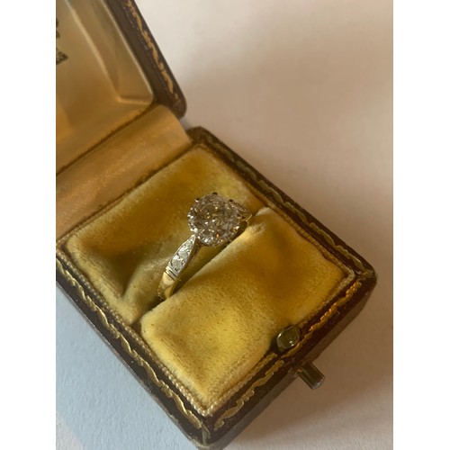 931 - A gold solitaire diamond ring, having a single old brilliant cut diamond in a claw setting with chen... 