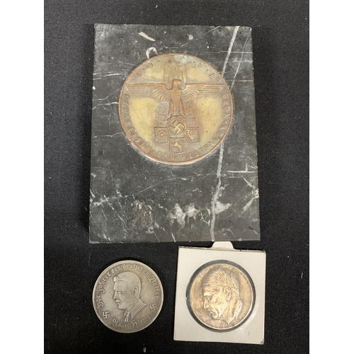 712 - 2 Nazi coins and plaque on marble base