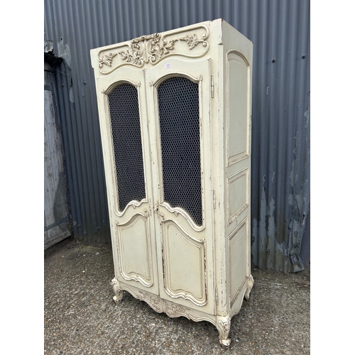 111 - A French style white painted armoire cupboard with part fitted interior  98x56x200