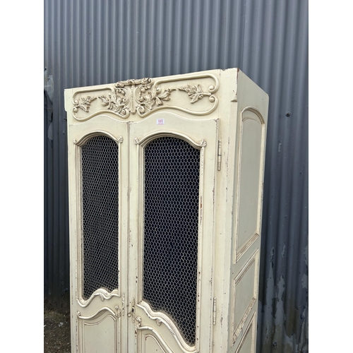 111 - A French style white painted armoire cupboard with part fitted interior  98x56x200