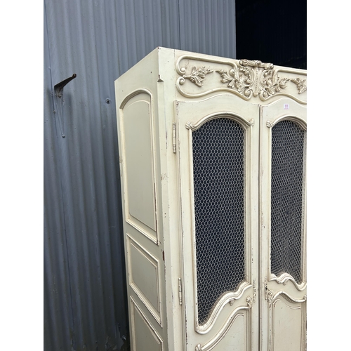 111 - A French style white painted armoire cupboard with part fitted interior  98x56x200
