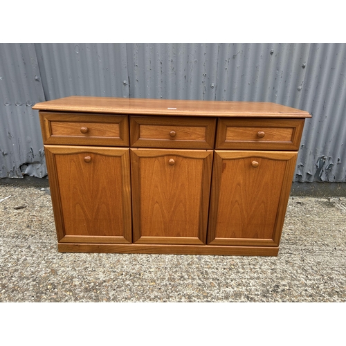 239 - A mid century teak three drawer sideboard 120x50x77