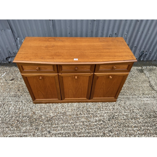 239 - A mid century teak three drawer sideboard 120x50x77