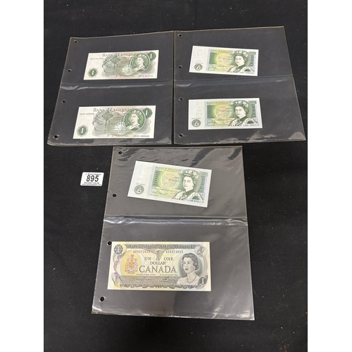 Nine One pound notes and one Canadian Dollar one Dollar Note
