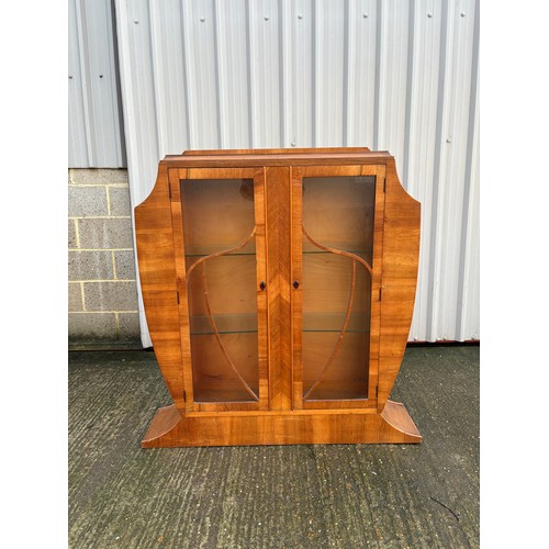 246 - An art deco shaped walnut glazed display cabinet 113x28x126