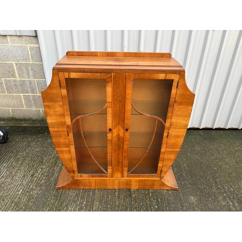 246 - An art deco shaped walnut glazed display cabinet 113x28x126
