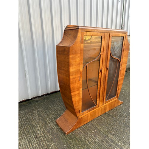 246 - An art deco shaped walnut glazed display cabinet 113x28x126