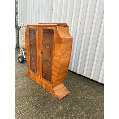 246 - An art deco shaped walnut glazed display cabinet 113x28x126