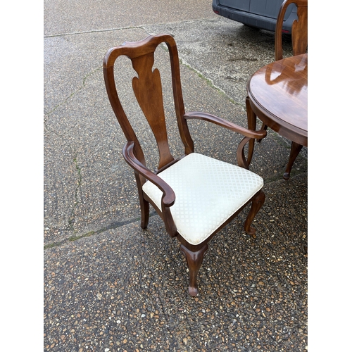 A large mahogany extending dining table with two extension leaves max ...