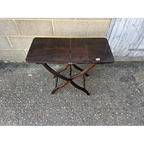 231 - A Victorian mahogany folding campaign style table