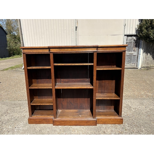 236 - An oak open fronted bookcase with seven adjustable shelves 160x30x130