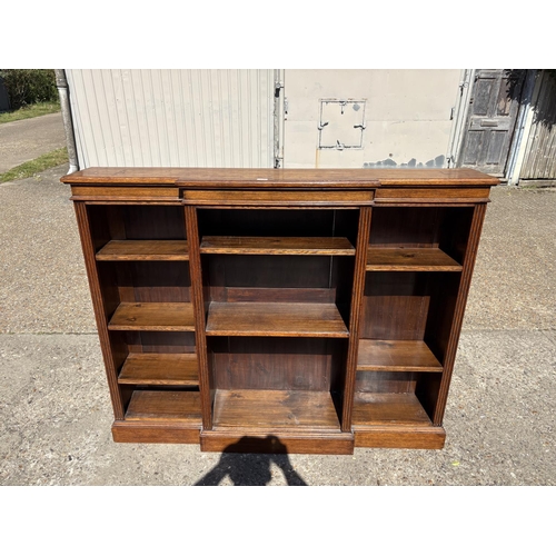 236 - An oak open fronted bookcase with seven adjustable shelves 160x30x130