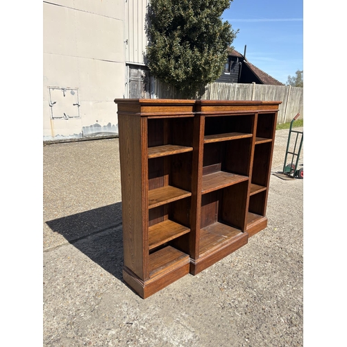 236 - An oak open fronted bookcase with seven adjustable shelves 160x30x130