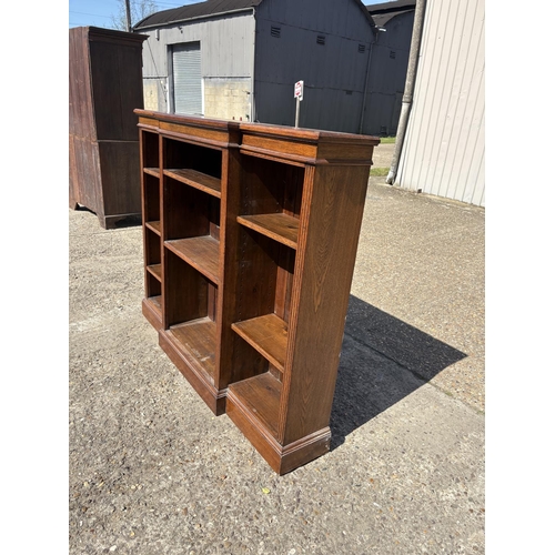 236 - An oak open fronted bookcase with seven adjustable shelves 160x30x130