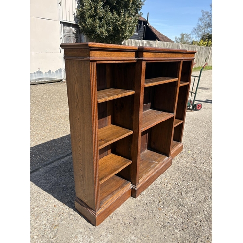 236 - An oak open fronted bookcase with seven adjustable shelves 160x30x130