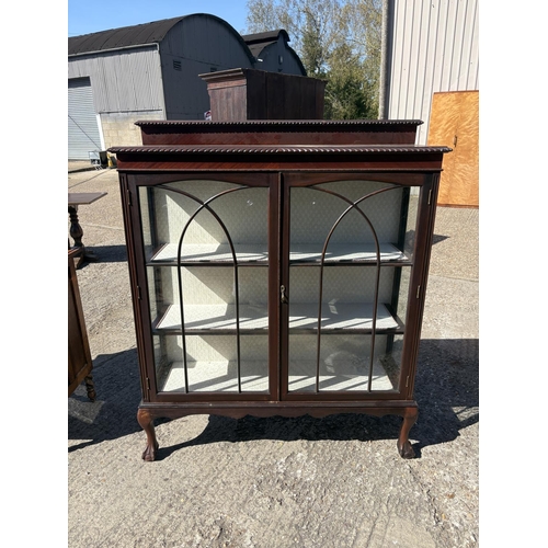 245 - A large mahogany display cabinet on ball and claw feet 120x40x140