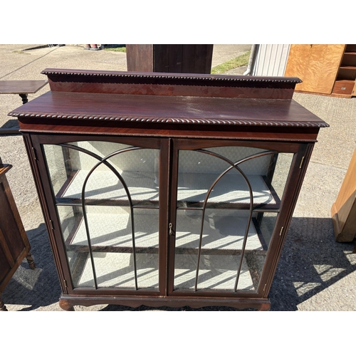 245 - A large mahogany display cabinet on ball and claw feet 120x40x140