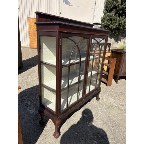 245 - A large mahogany display cabinet on ball and claw feet 120x40x140
